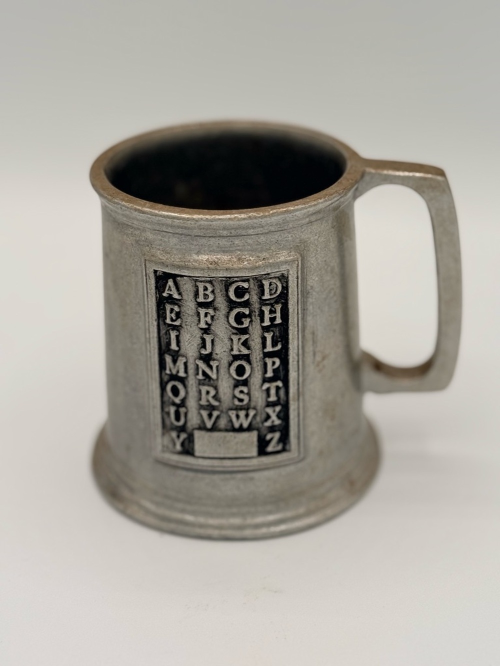 Vintage Wilton Armetale pewter child's mug with embossed alphabet.